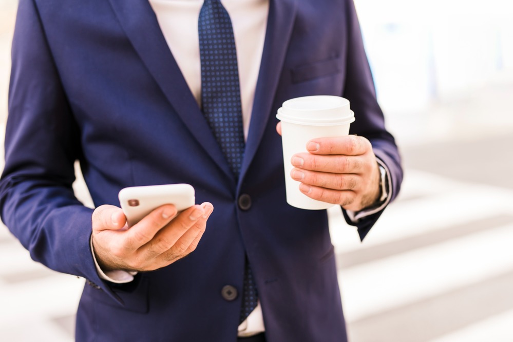 business-man-using-his-phone.jpg