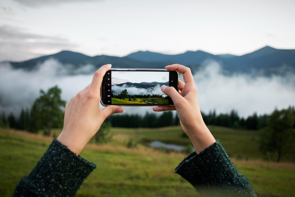 woman-taking-photo-rural-surroundings.jpg